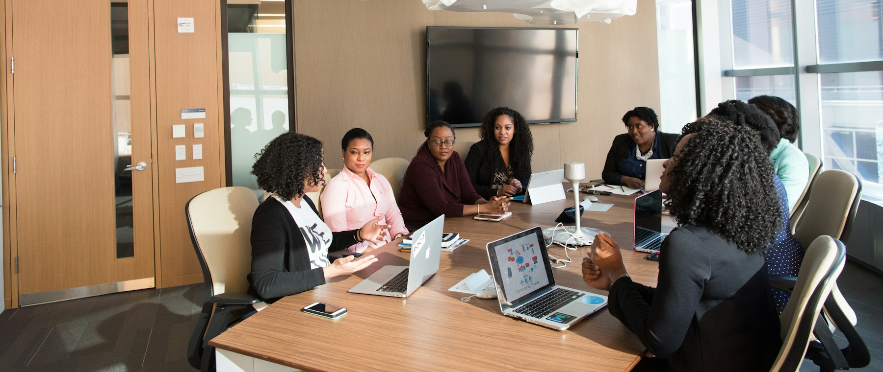 A team working through a session around a boardroom table