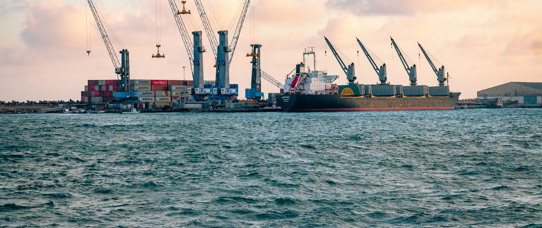 Cranes and cargo ships at a working port