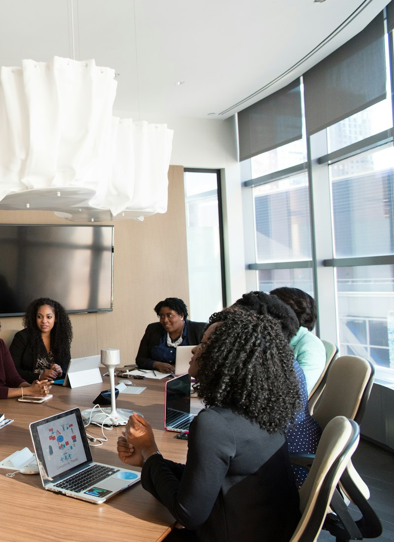 A team working through a session around a boardroom table