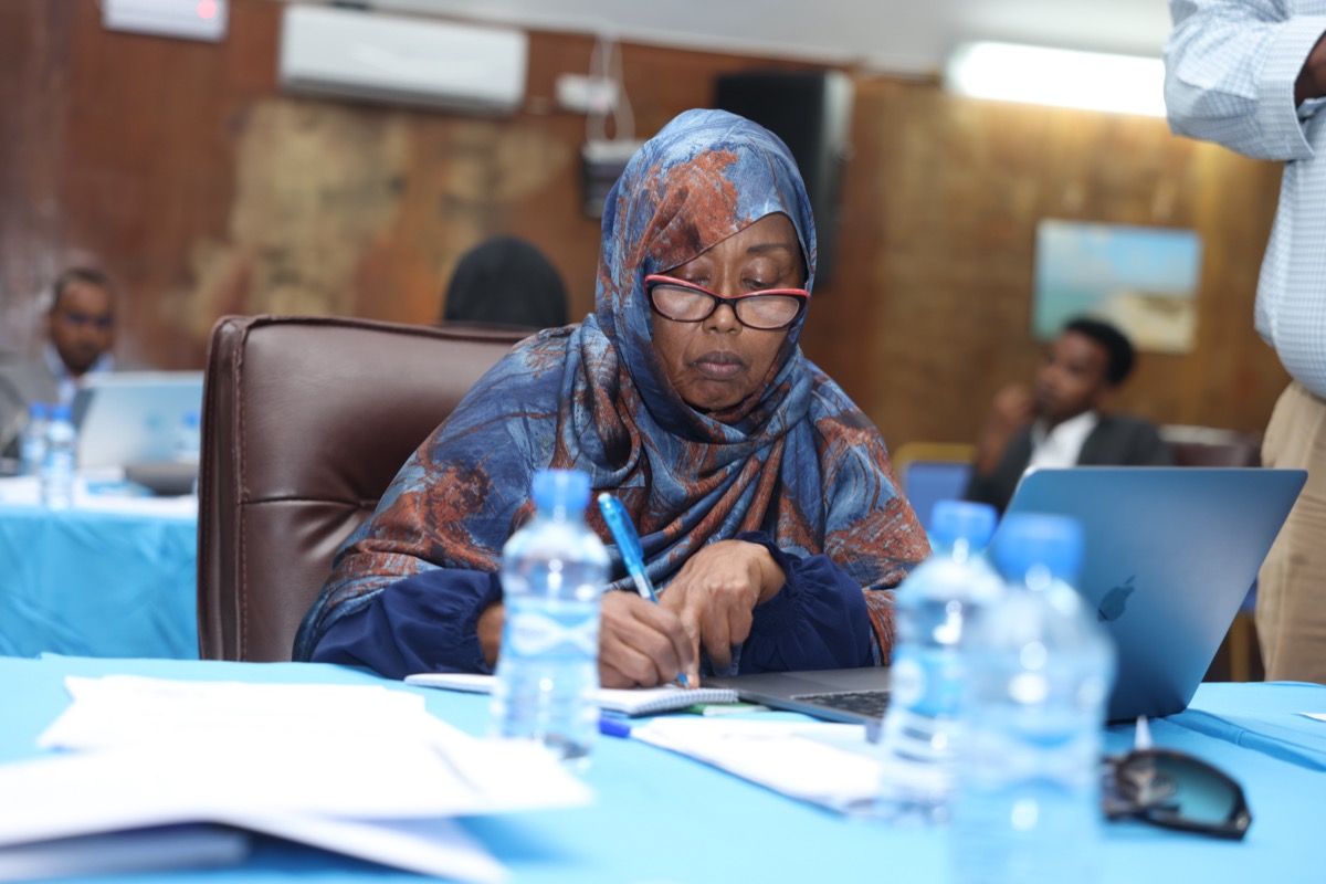 A delegate listening during a session