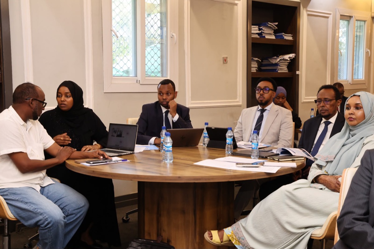 Participants in discussion around a roundtable